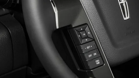 Steering wheel control buttons close up 2017 Lincoln Navigator Select 200A Stock Footage 159899587