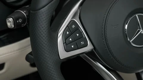 Steering wheel control buttons close up 2017 Mercedes-Benz SL-Class SL550 Stock Footage 159910917