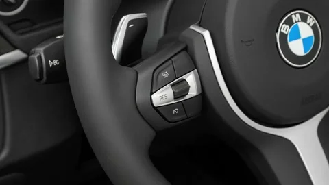 Steering wheel control buttons close up 2017 BMW 4-series 440i Gran Coupe Stock Footage 159921764
