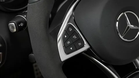 Steering wheel control buttons close up 2017 Mercedes-Benz C-Class AMG C43 Video stock 159922023