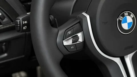 Steering wheel control buttons close up 2017 BMW 2-series M2 Stock Footage 159927630