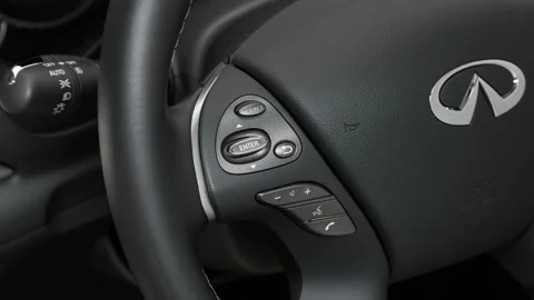 Steering wheel control buttons close up 2017 Infiniti Q70L 3.7 Stock Footage 159928972