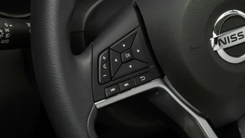 Steering wheel control buttons close up 2017 Nissan Rogue Sport SV Stock Footage 159952759