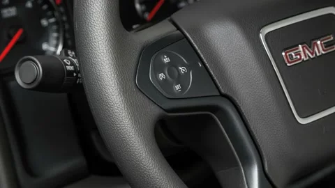 Steering wheel control buttons close up 2017 GMC Sierra 3500HD SRW SE Stock Footage 159954113