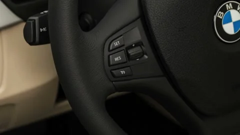 Steering wheel control buttons close up 2018 BMW 3-series 320i Stock Footage 159971042