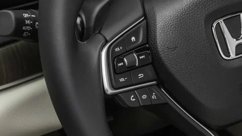 Steering wheel control buttons close up 2018 Honda Accord Hybrid Touring Stock Footage 160010201