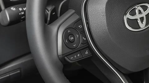Steering wheel control buttons close up 2019 Toyota Corolla Hatchback SE Stock Footage 160020886