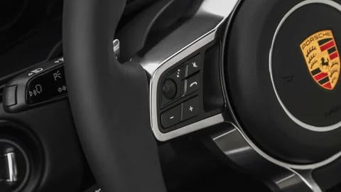 Steering wheel control buttons close up 2019 Porsche Cayenne LS Stock Footage 160032545