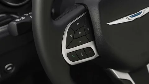 Steering wheel control buttons close up 2019 Chrysler 300 Touring Stock Footage 160033896