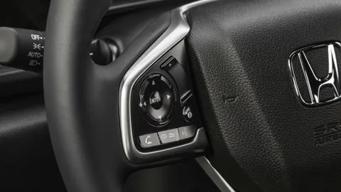 Steering wheel control buttons close up 2019 Honda Civic Sport Stock Footage 160044013