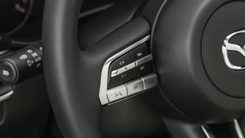 Steering wheel control buttons close up 2019 Mazda MAZDA3 w/ Select Package Stock Footage 160066354