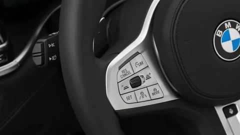 Steering wheel control buttons close up 2020 BMW 7-series 750i xDrive Stock Footage 160080328