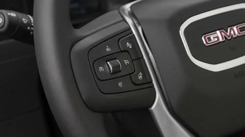 Steering wheel control buttons close up 2020 GMC Sierra 2500HD SLT Stock Footage 160085988