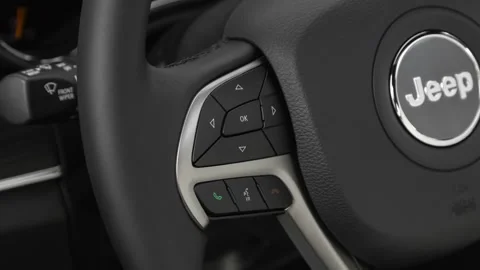 Steering wheel control buttons close up 2020 Jeep Grand Cherokee Limited Stock Footage 160087702