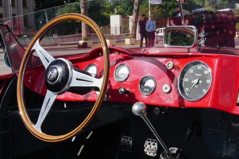 Steering wheel, driving panel of a red Alfa Romeo 2000 Sportiva retro race car. 스톡 사진