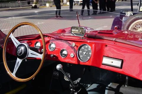 Steering wheel, driving panel of a red Alfa Romeo 2000 Sportiva retro race car. 스톡 사진
