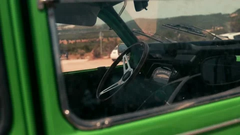 Steering wheel of a green old timer Vídeos de archivo 229192670
