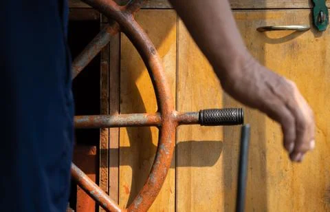Steering wheel of an old ship Stock Photos