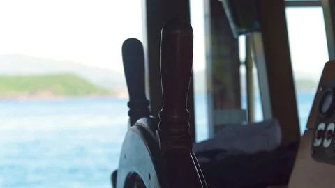 Steering wheel of sailing ship in captain bridge close up. Ship wheeel of Stock Footage 95876751