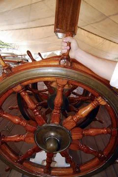 A steering wheel on a ship Stock Photos