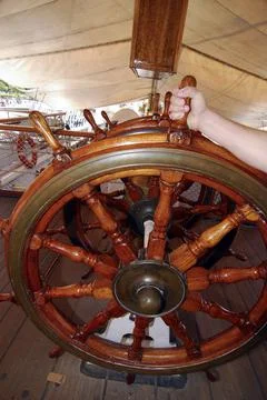 A steering wheel on a ship Stock Photos