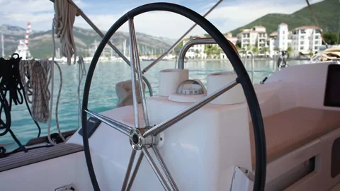 The steering wheel of a yacht. view from the deck. Sunny day in Montenegro. Stock Footage 248427638