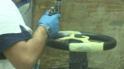Steering wheels being painted Stock Footage 22413809