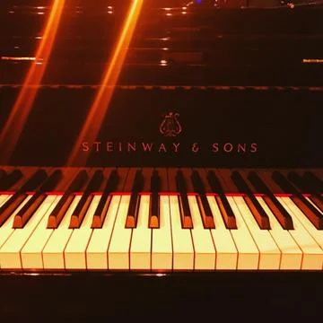 Steinway Piano on lighted Stage Stock Photos