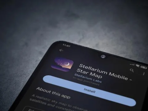 Stellarium - Star Map app play store page on smartphone on a dark marble sto Stock Photos