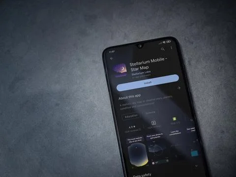 Stellarium - Star Map app play store page on smartphone on a dark marble sto Stock Photos
