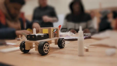 STEM class building robot cars close up tilt shift Stock Footage 283489789