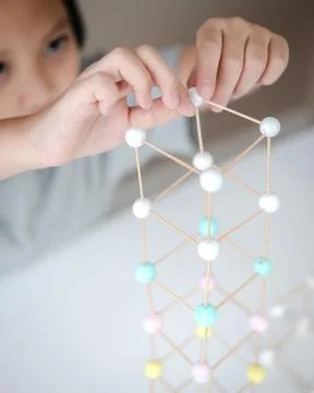 STEM education, Child learning making 3D geometric shapes, Building Structure Stock Photos