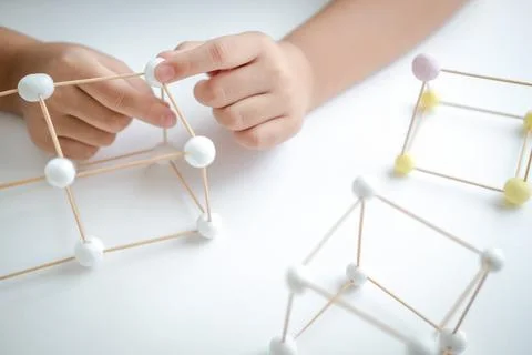 STEM education, Child learning making 3D geometric shapes, Building Structure Foto stock