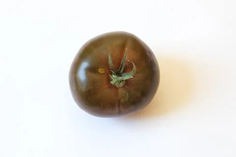 Stem end view of deep red green Cherokee Purple type organic heirloom tomato Stock Photos