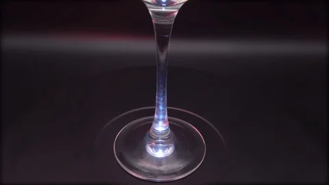 Stem of glass on dark background Stock Footage 114660561