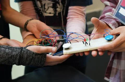 STEM students holding electronics project at a science event Stock Photos