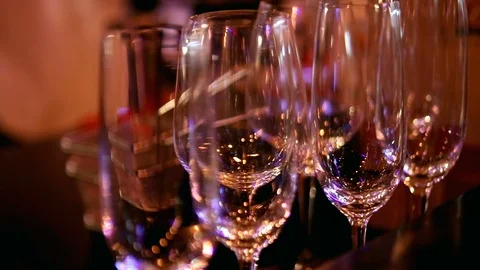 Stemware, wineglass close-up, glasses on the bar. Bar theme, beverages. Night Video stock 90782089