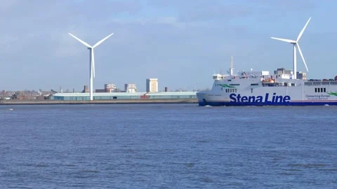 The Stena Ferry passes wind turbines on the River Mersey in Liverpool, UK Stock Footage 143256992