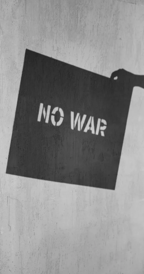 Stencil Board Show A NO WAR' Statement From Its Projected Shadow Off The Wal Stock Footage 201317731