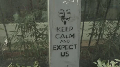 Stencil Graffiti With Text and Mask Art in 798 Art District Beijing China Stock Footage 341714004