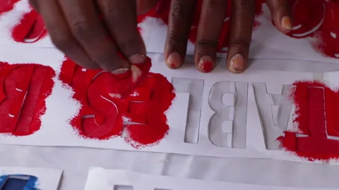 Stenciling - Person Applying Ink On Stencil To Transfer A Design Onto A Stock Footage 279984132