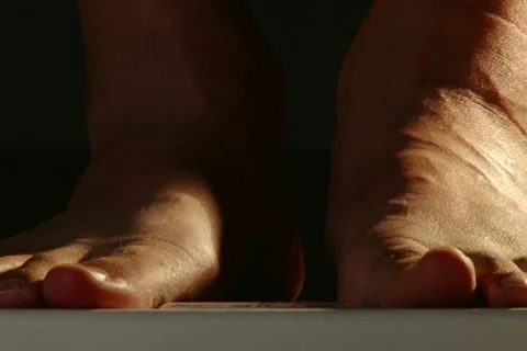 Stending on a scale. Stock Footage 20505385