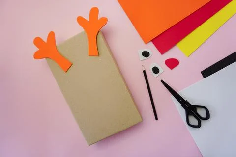 Step 2. Making a gift package in the form of a Christmas deer Stock Photos