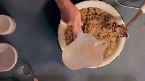 Step 2 soaking torn egg cartons in water for papier mache pulp preparation top v Stock Footage 330682246