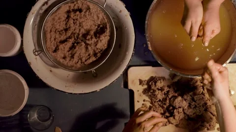 Step 2 soaking torn egg cartons in water for papier mache pulp preparation top v Stock Footage 330683713