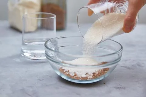 Step 3. Add sugar and water to make dalgon coffee. Trending Korean drink. Step Stock Photos