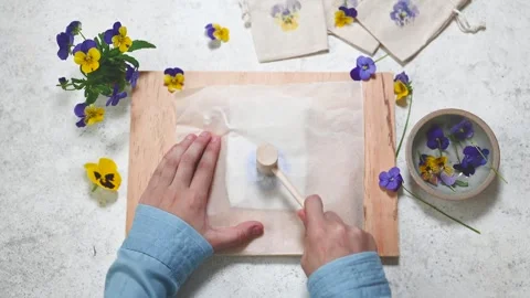 Step 3. Child takes a hammer and begins to pound the flower. Stock Footage 280359697