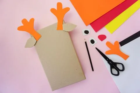 Step 3. Making a gift package in the form of a Christmas deer Stock Photos