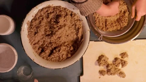 Step 3 squeezing paper pulp by hand for papier mache mixture Stock Footage 330682842