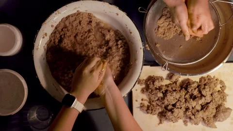 Step 3 squeezing paper pulp by hand for papier mache mixture Stock Footage 330683292